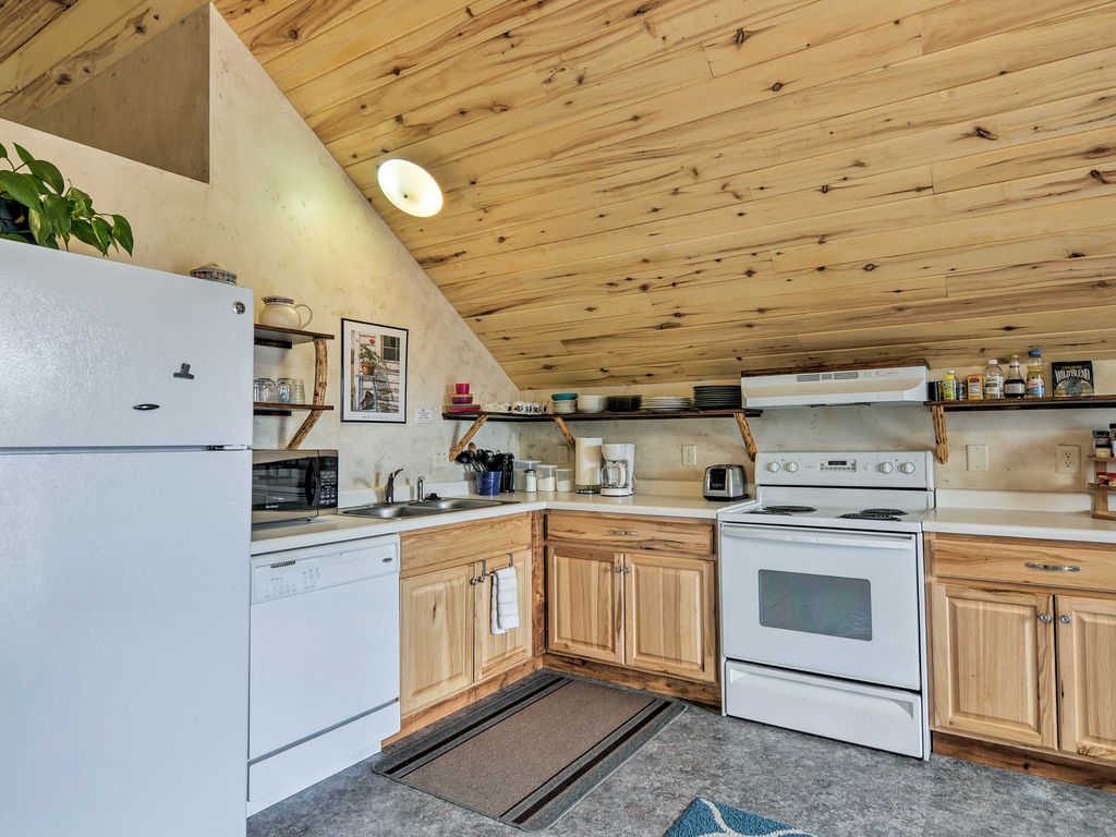 Sunrise Hollow's roomy, fully-stocked kitchen boasts a stove, fridge, microwave, and dishwasher for your cooking convenience.
